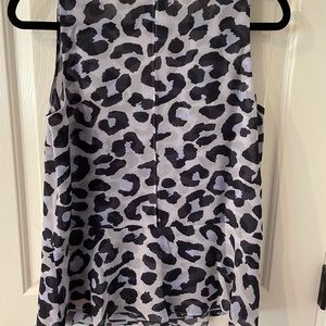 Cabi feline top in size small. Has a built in cami - very flattering top